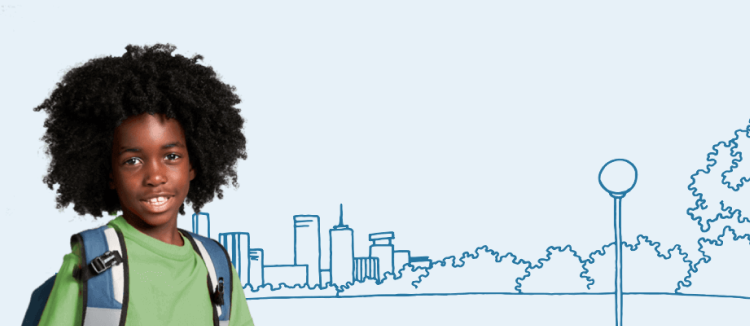 Boy with backpack near a park